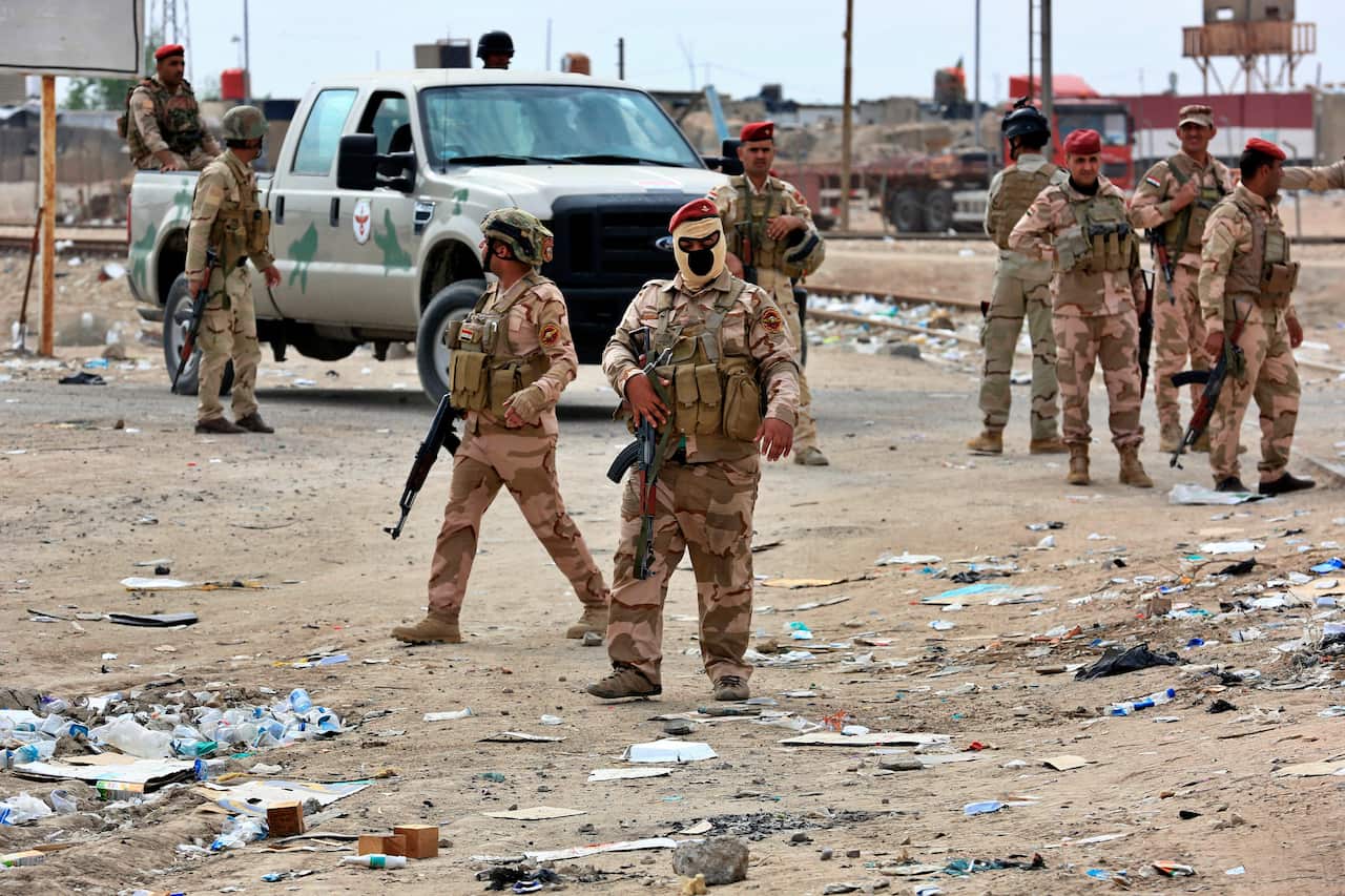 Iraqi security forces at the Umm Qasr port, Iraq. At least five protesters were killed by Iraqi troops.