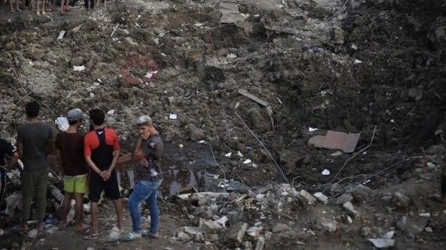 At least 18 people were killed and dozens injured after an arms depot exploded in the Sadr City district of the Iraqi capital late on June 7.