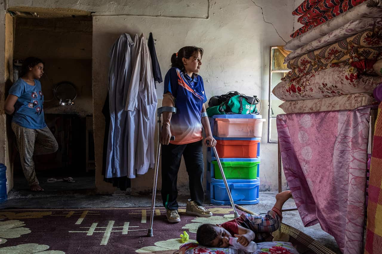 Najla Imad Lafta, a triple amputee and member of the Iraqi Paralympic Table Tennis team, at her home in Baqubah, Iraq, June 14, 2019. (Ivor Prickett/The New York Times)