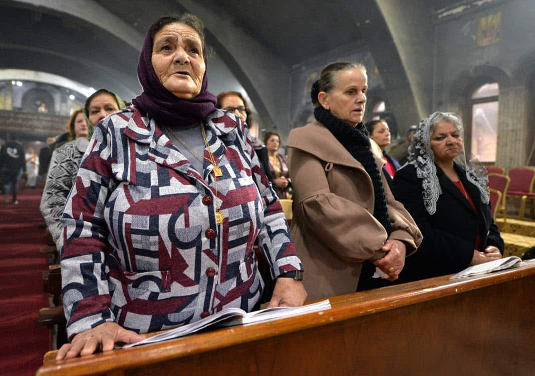 Iraqi Catholic Christians attend a Christmas morning mass at the Mar Behnam church at the Assyrian town of Qaraqosh, some 13 km east of Mosul, northern Iraq, 25 December 2018 (AAP)