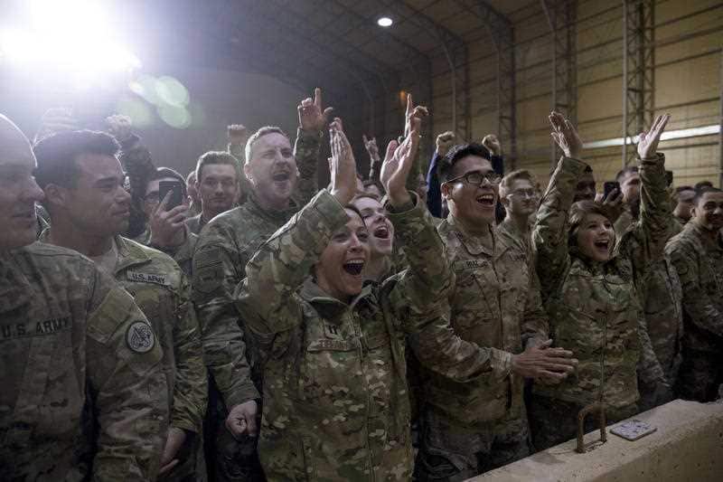 US Army soldiers cheer as the president enters the hanger at Al Asad Air Base, Iraq.US Army soldiers and Navy sailors cheer as the president enters the hanger at Al Asad Air Base, Iraq.