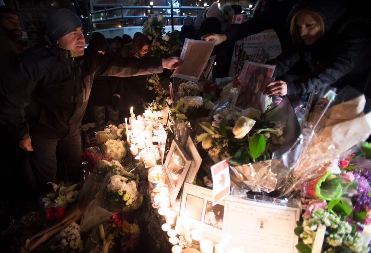 Mourners attend a memorial in North Vancouver, British Columbia, to remember Canadian victims of the tragedy.