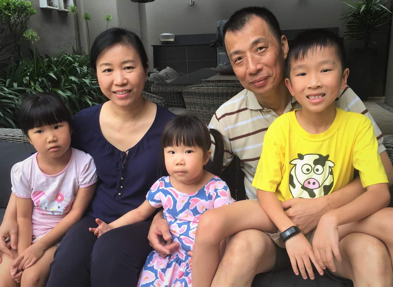 Iris Ni with her husband Alex, son Braydon, and daughters Carol and Chloe (left)