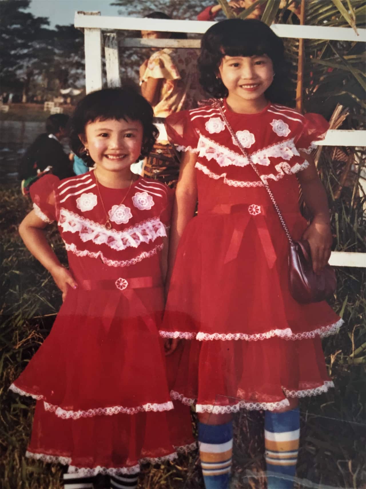 Iris (right) with her younger sister in Cambodia.
