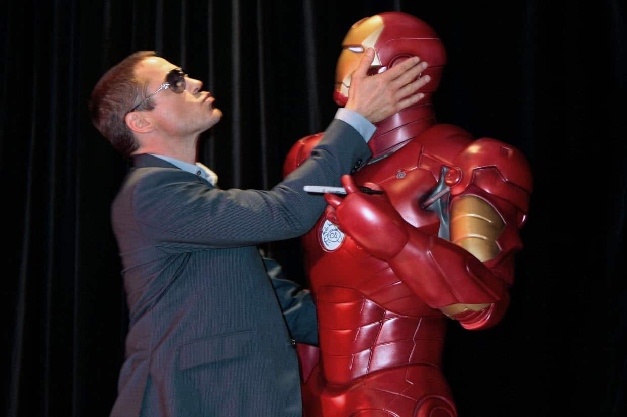 Actor Robert Downey Jr holds an 'Iron Man' mannequin in Sydney in 2008.