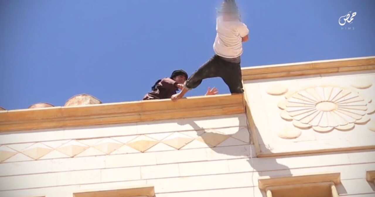 A man is thrown from a rooftop. 