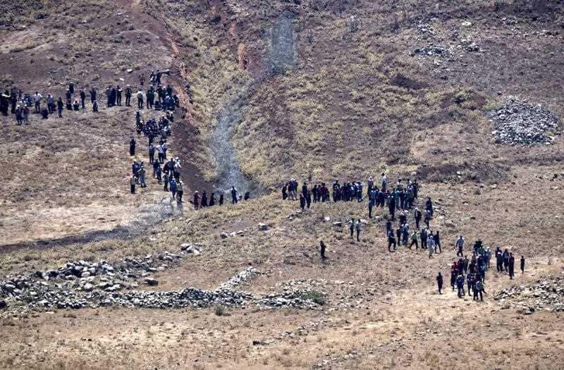  Syrian Refugees march toward the Israeli Security fence demanding help.