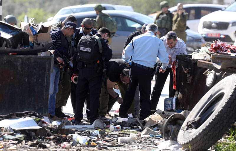 sraeli authorities inspect the scene, where a Palestinian person was shot, for evidence in Huwara village, near the West Bank city of Nablus.