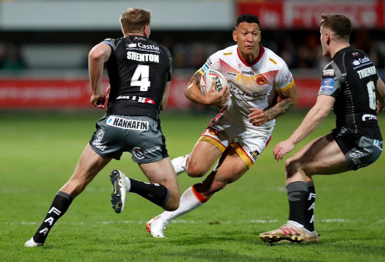 Folau in action against Castleford Tigers’ Michael Shenton, left, and Jake Trueman.