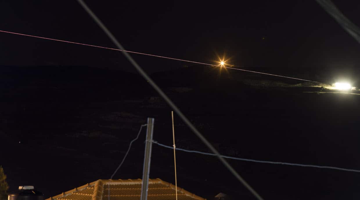 A long exposure picture shows Israeli artillery deployed missiles toward Syrian military targets, on the Golan Heights, next to the Israeli-Syrian border.