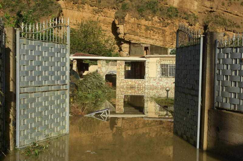 At least 10 people, including nine members of two families, have died as a result of floods as heavy rains and bad weather in Sicily.