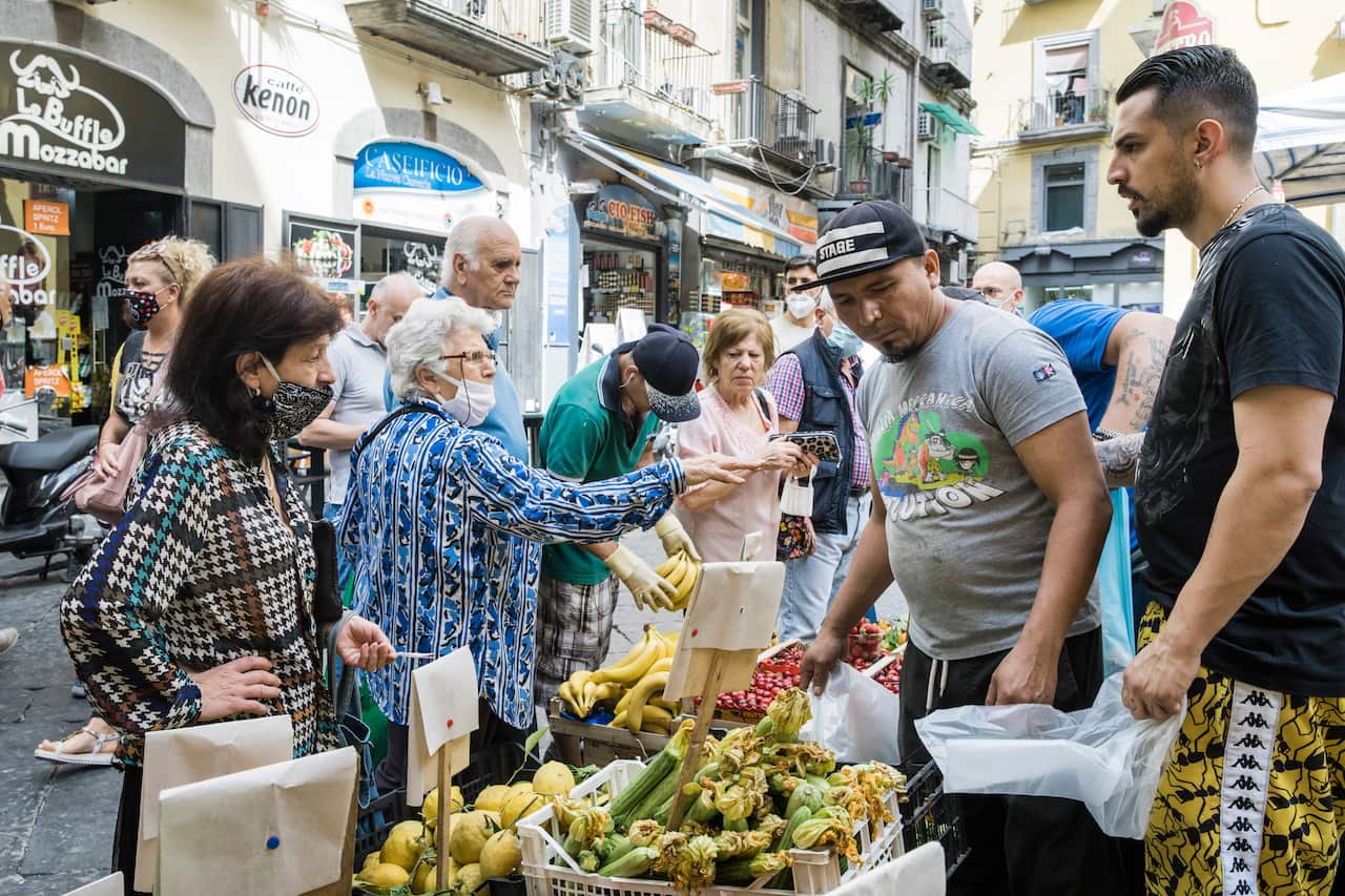 Shoppers in Pignasecca, an outdoor market in central Naples, Italy, June 19, 2020. 