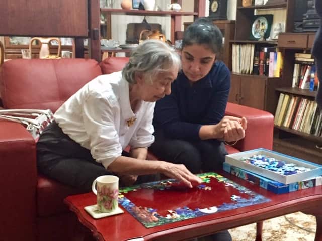 Ivy Anderson and Sukhjeet Atwal enjoy doing puzzles during regular care sessions.