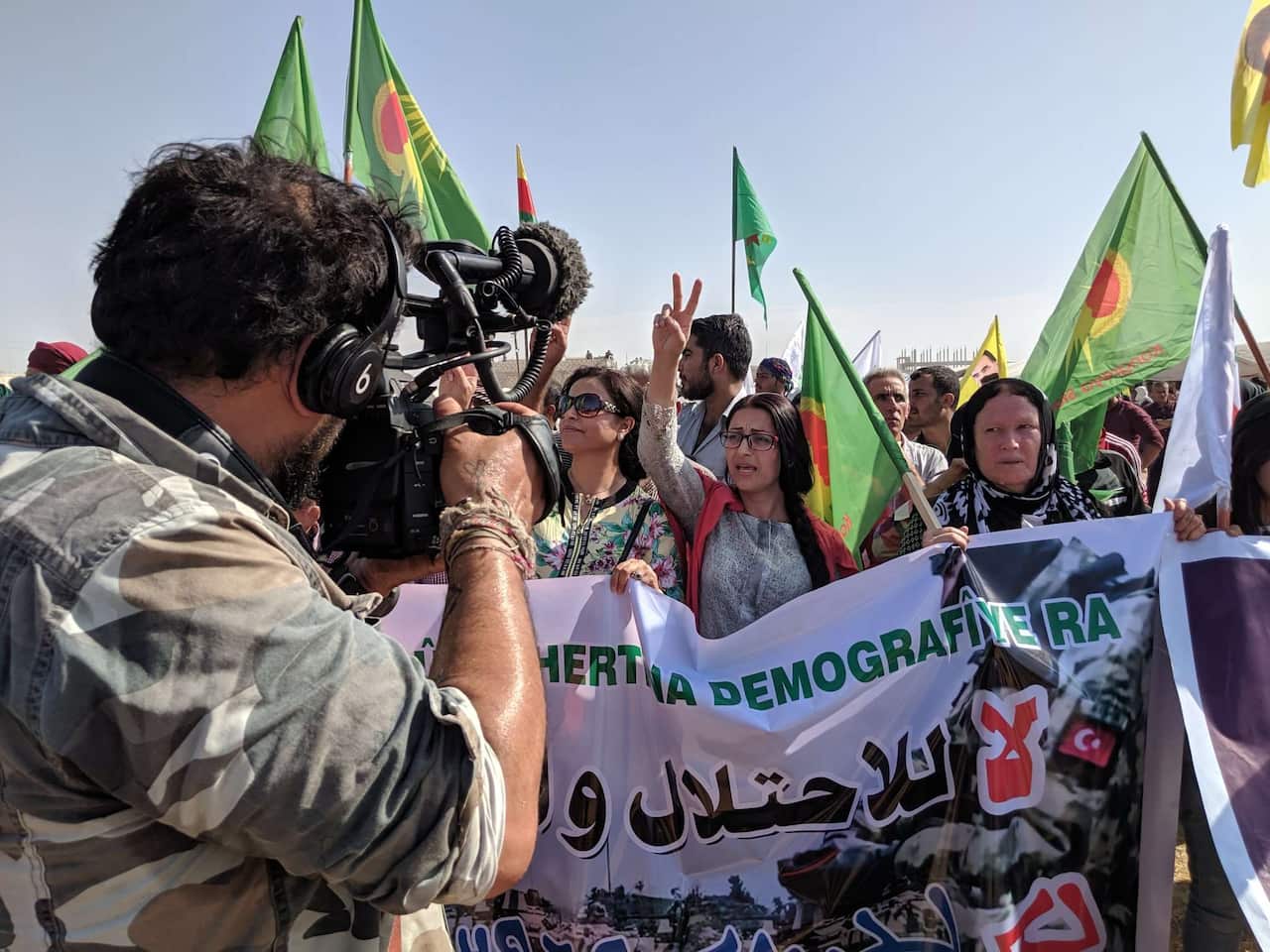 Australian filmmaker Jake Simkin films a rally in Ras al-Ain hours before shelling broke out. 