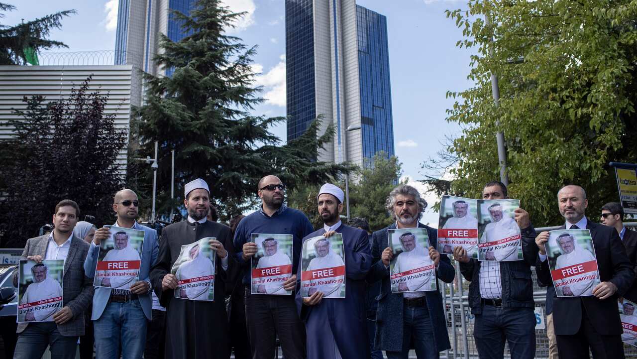 Protesters hold pictures of Saudi Journalist Jamal Khashoggi during a demonstration organized by Turkish-Arabic Media Association.