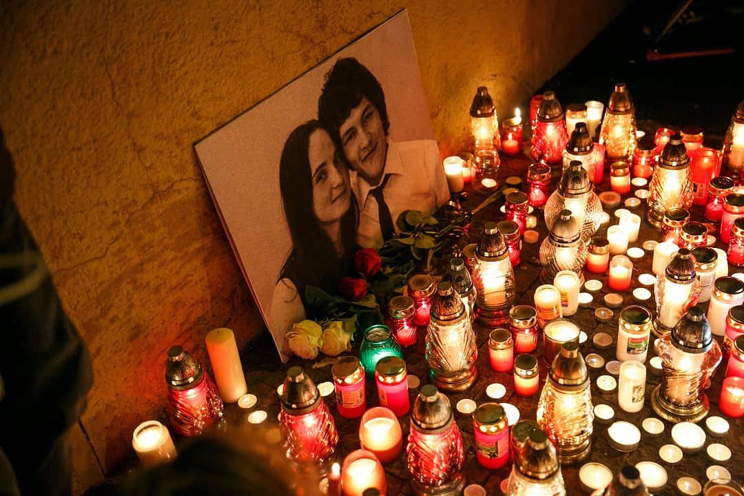 People light candles during a candlelight vigil for murdered Slovak journalist Jan Kuciak and his fiancee, Martina Kusnirova, in Slovakia on 26 February 2018. 