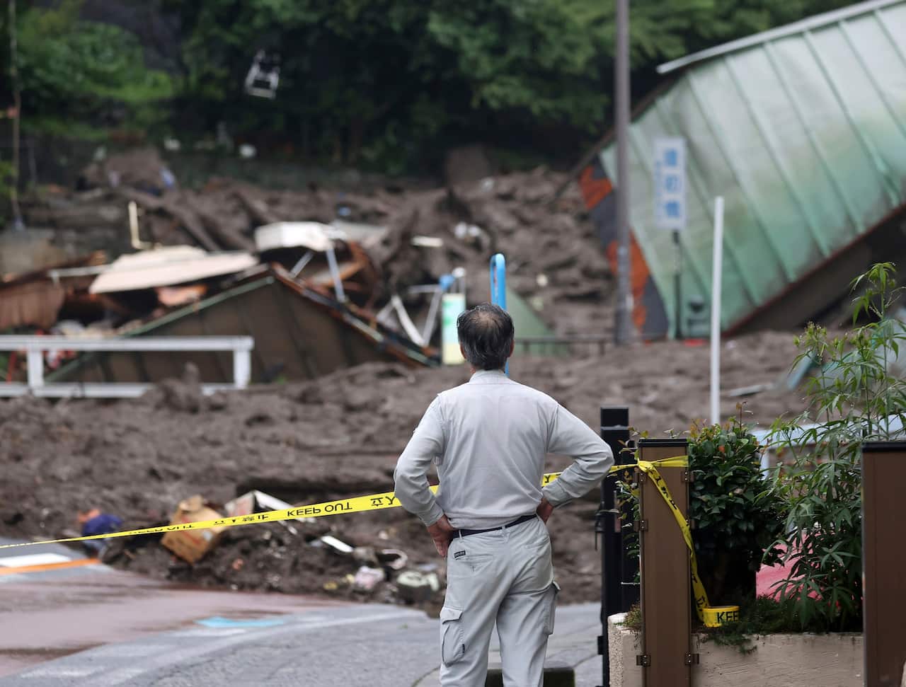 Houses are swept away with a mudslide at Izuyama district, Atami, Shizuoka Prefecture.