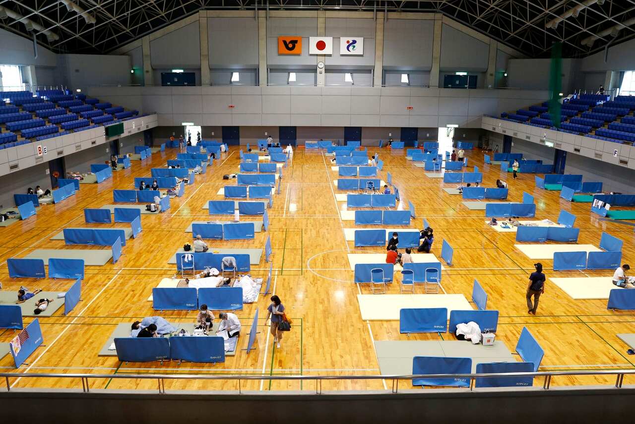 Social distancing is maintained at a shelter for evacuees in the flood-ravaged city of Hitoyoshi in Kumamoto Prefecture, southwestern Japan.