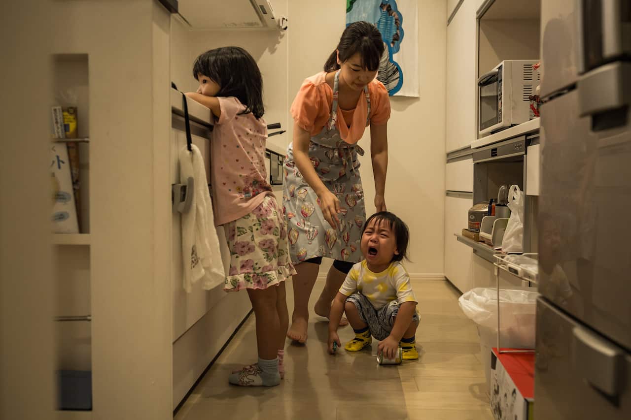 Yoshiko Nishimasas son, Haruki, reacts to an accident while he was playing in the kitchen, in Tokyo.
