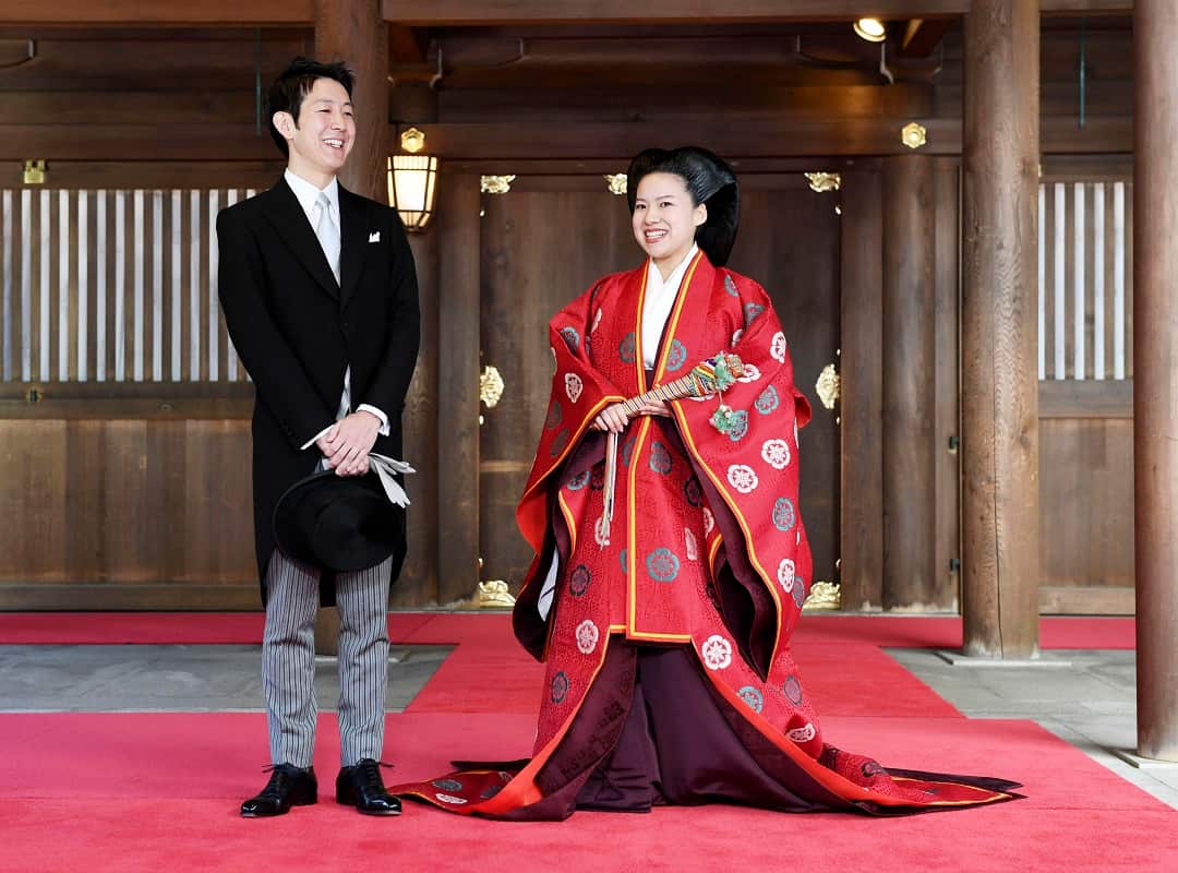 Japanese Princess Ayako, dressed in traditional ceremonial robe, married groom Kei Moriya in a Shinto-style wedding. 