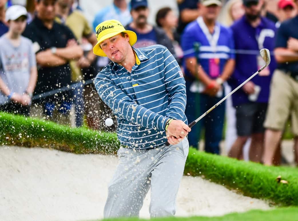 File: Jarrod Lyle hits from the bunker on #9 during third round action of the Crowne Plaza Invitational in 2015