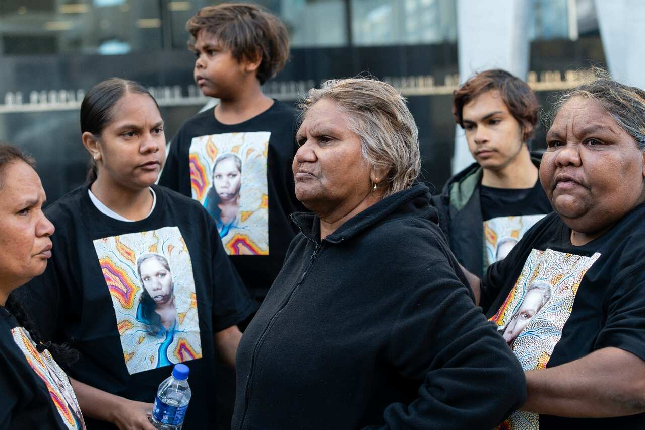 Anne Jones (centre) the foster mother of JC is surrounded by family and friends outside the Supreme Court in Perth on 22 October.