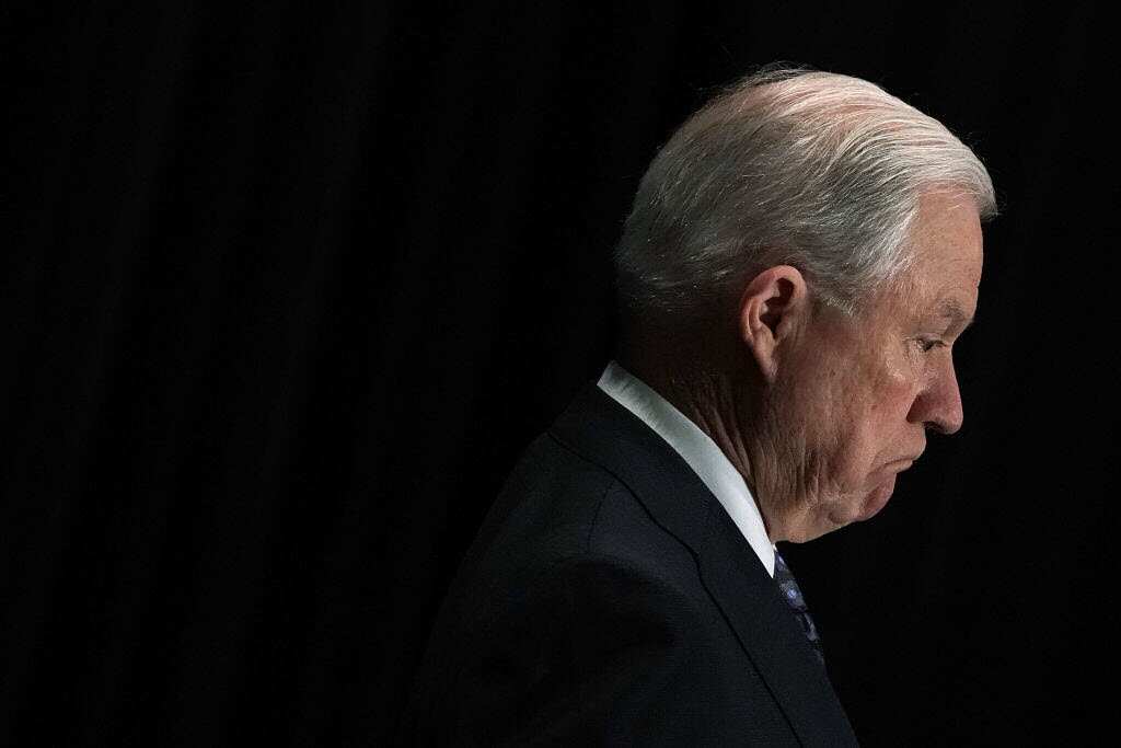 Attorney General Jeff Sessions listens as he is introduced 