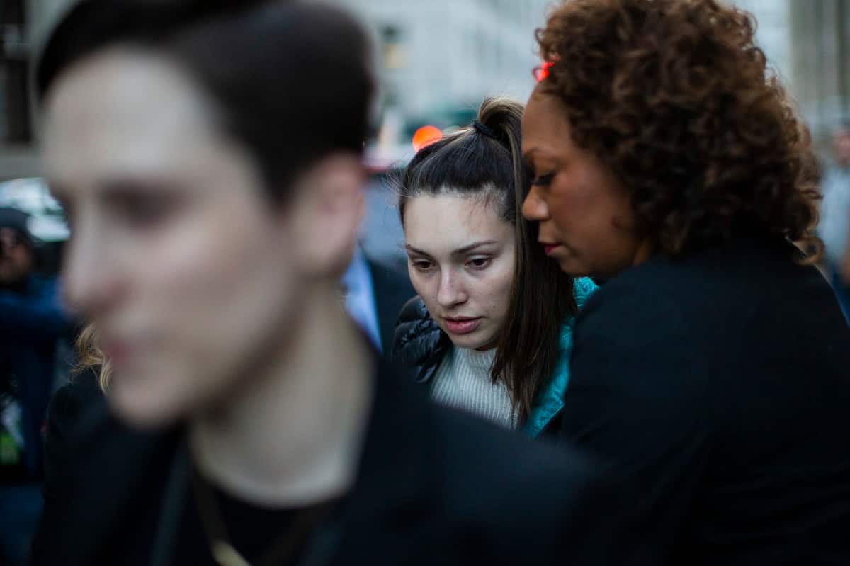 Jessica Mann (c) exits the Manhattan criminal court after testifying against film producer Harvey Weinstein.