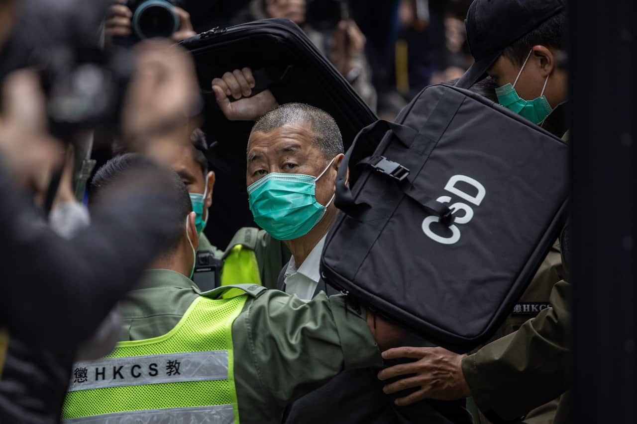 Media mogul Jimmy Lai is escorted out of a Correctional Services Department vehicle on his way to the Court of Final Appeal in Hong Kong on 9 February 2021.
