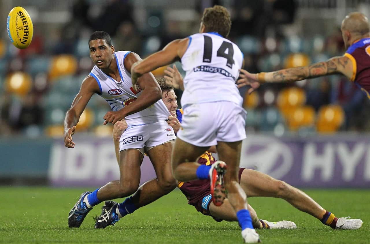 Joel Wilkinson (left) & Nathan Krakouer (right) during the round 21 game between the Brisbane Lions and Gold Coast Suns on Saturday, Aug. 13, 2011.