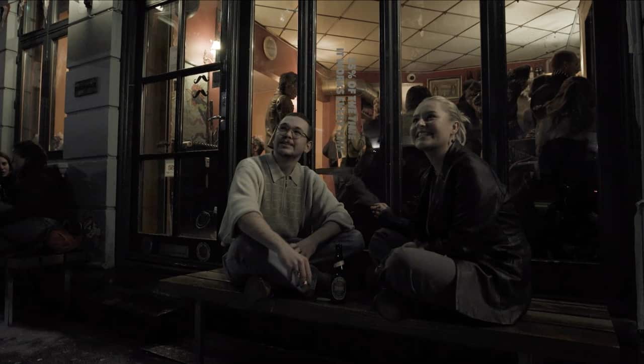 Johan and Johanna sit outside a pub in Denmark.