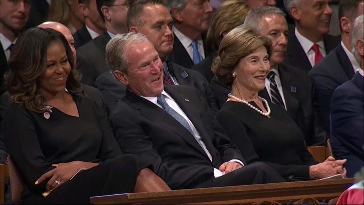 George W Bush during a lighter moment in the service.