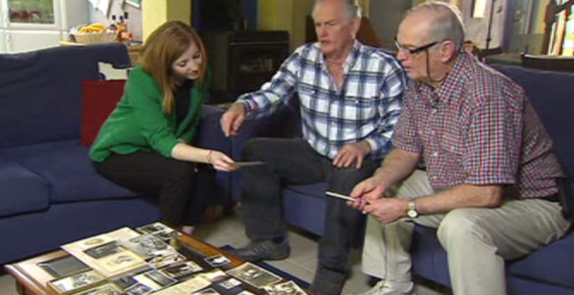 John and David Knudsen look at old photos of their grandparents.