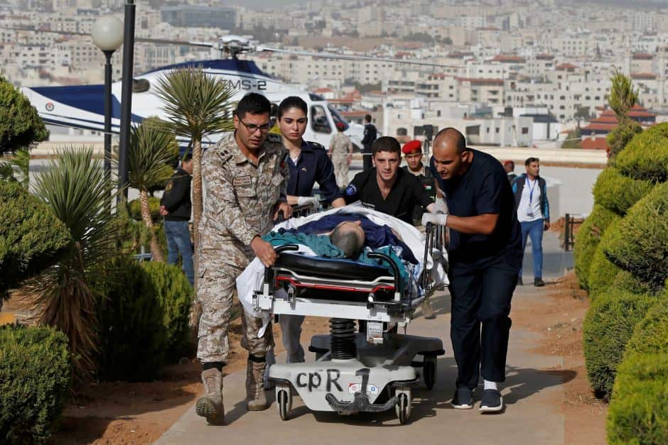 Emergency services rush an injured tourist to the King Hussein Medical Centre in Amman after the attack. 