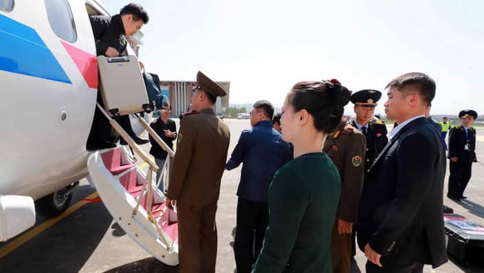 South Korean reporters arrive at an airport in Wonsan, North Korea to cover the dismantlement of North Korea's nuclear test facilities.