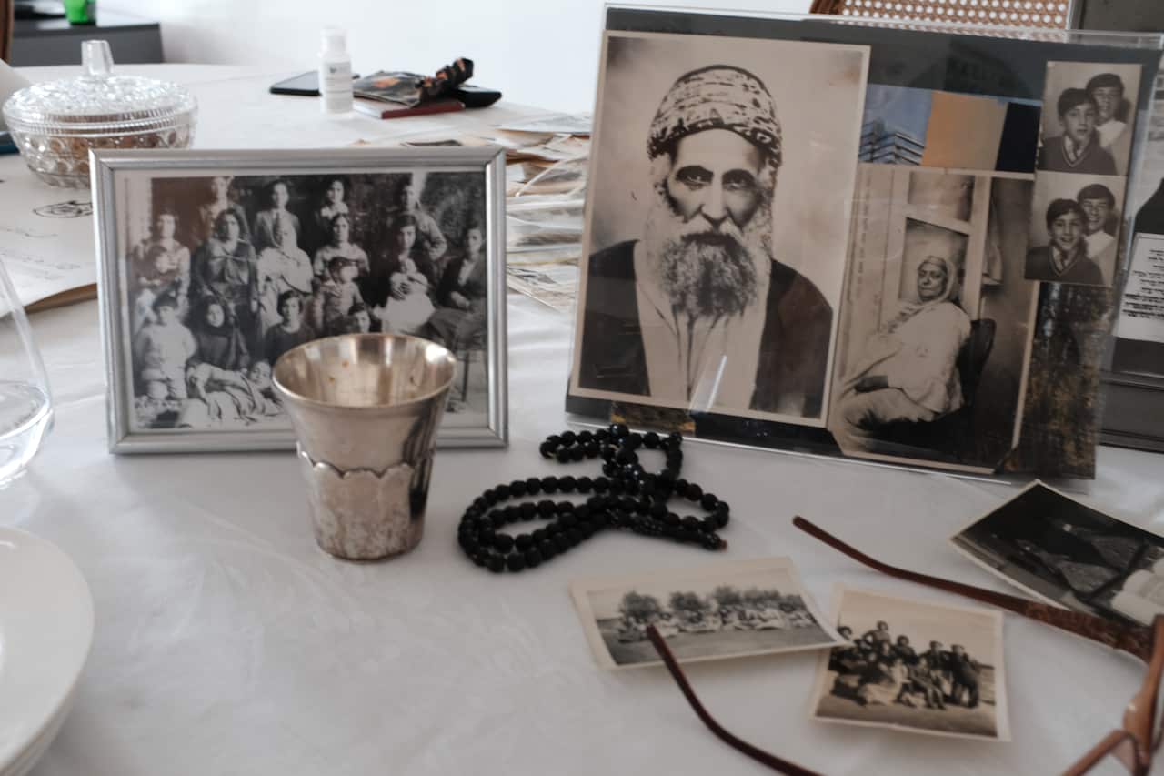 A collection of family heirlooms and photographs illustrating Julie's family ties to Iraq before Farhud.