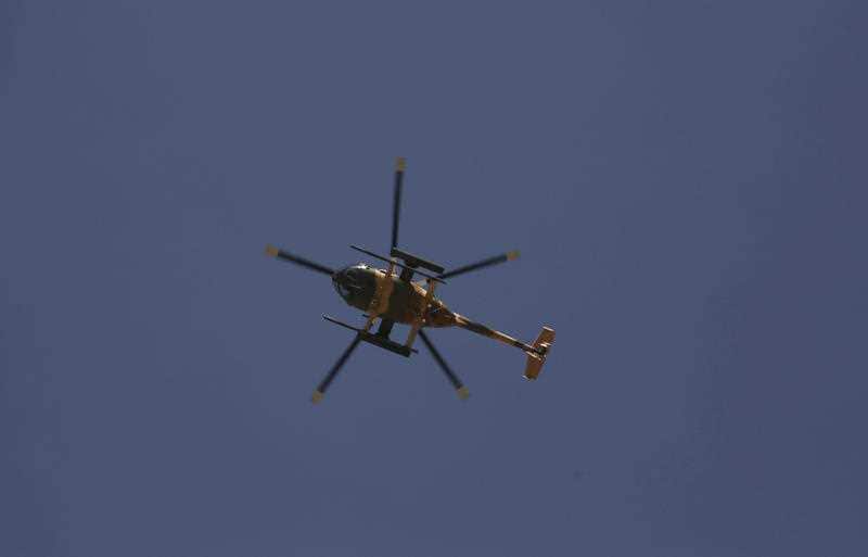 A gunship hovers overheard during the fighting.