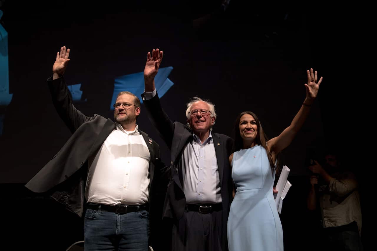 From right, Alexandria Ocasio-Cortez, Sen. Bernie Sanders (I-Vt.) and James Thompson, a Kansas House candidate, at a campaign event for Thompson in Wichita on Friday, July 20, 2018.