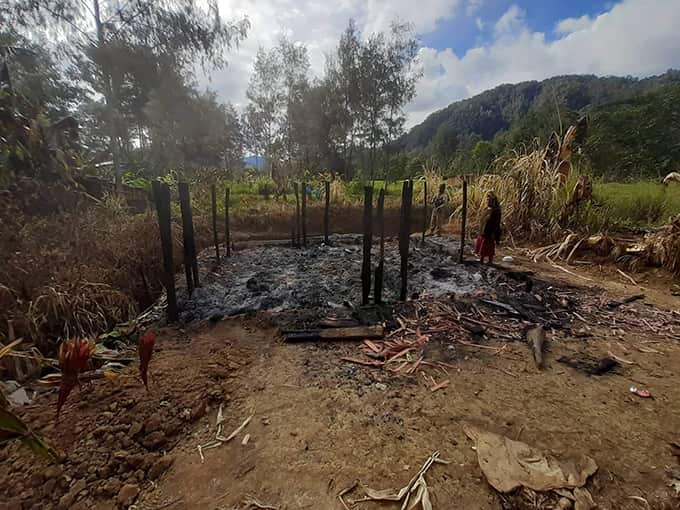 Burnt remains of a house in Karida village after attack in tribal war.