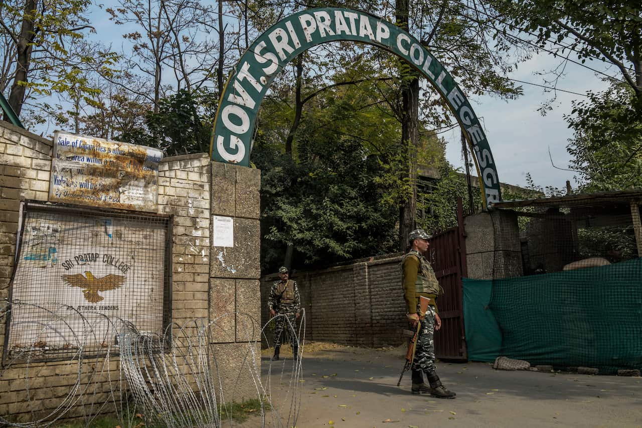 Security forces outside Sri Pratap College in Srinagar, India.