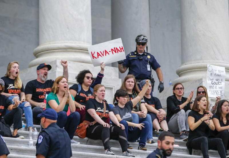 Protestors storm the East Front steps of the US Capitol before the US Senate votes on the confirmation.
