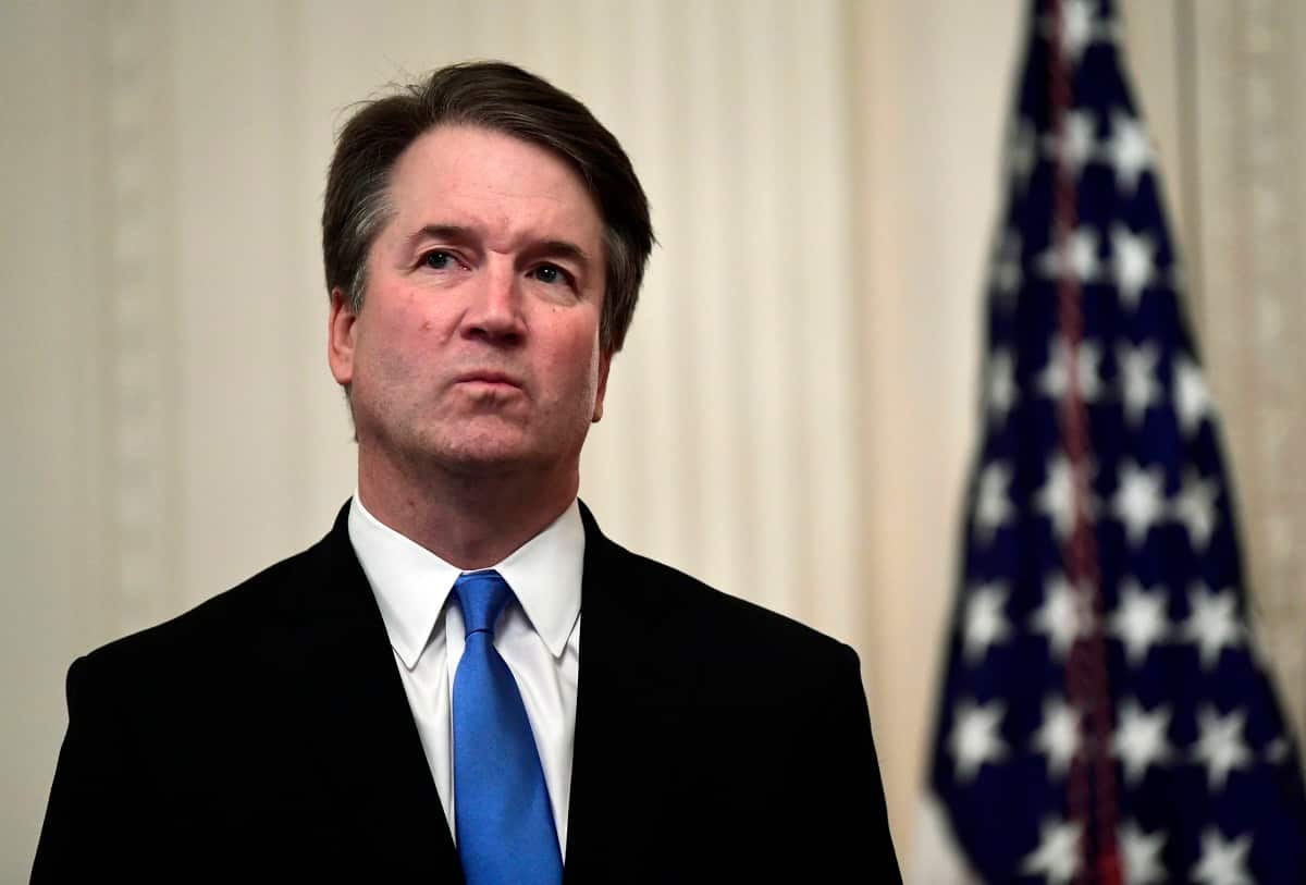 In this photo, Supreme Court Justice Brett Kavanaugh stands before a ceremonial swearing-in in the East Room of the White House in Washington. 