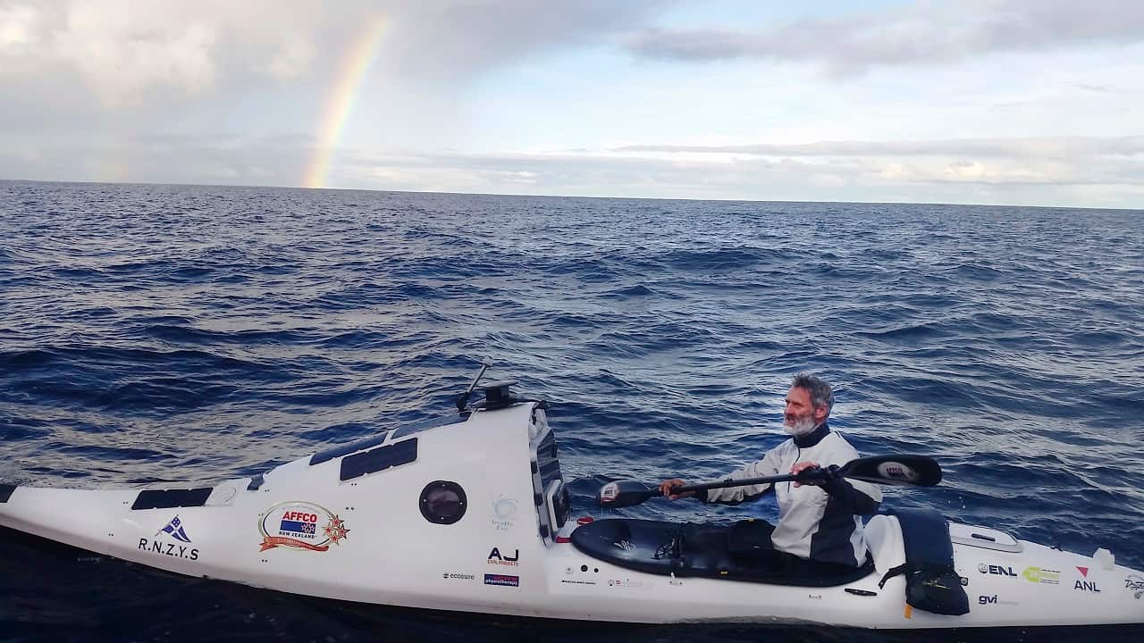 Scott Donaldson paddles his kayak in the Tasman Sea.