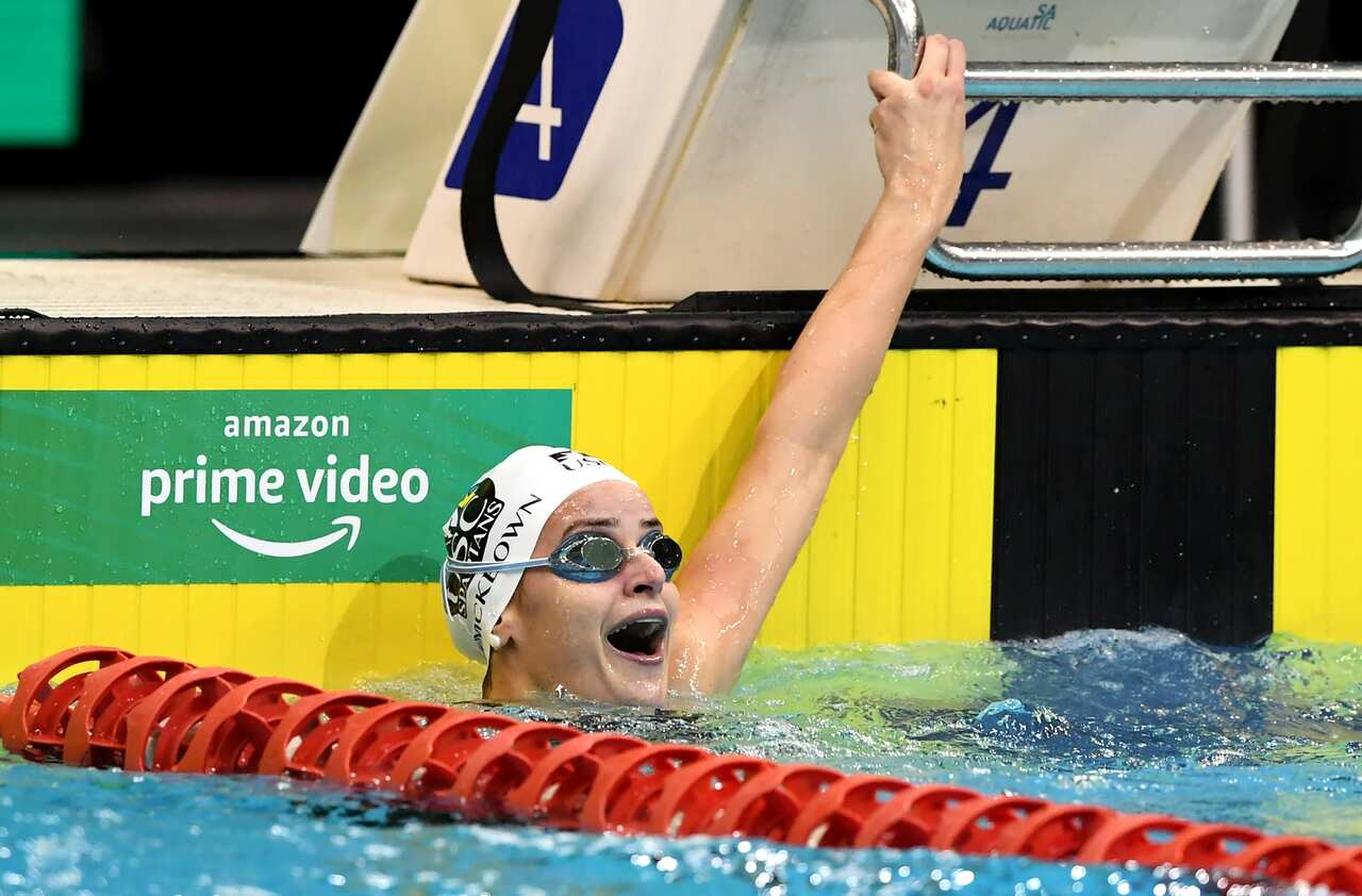 Kaylee McKeown reacts after setting a new world record in the womens 100m backstroke.