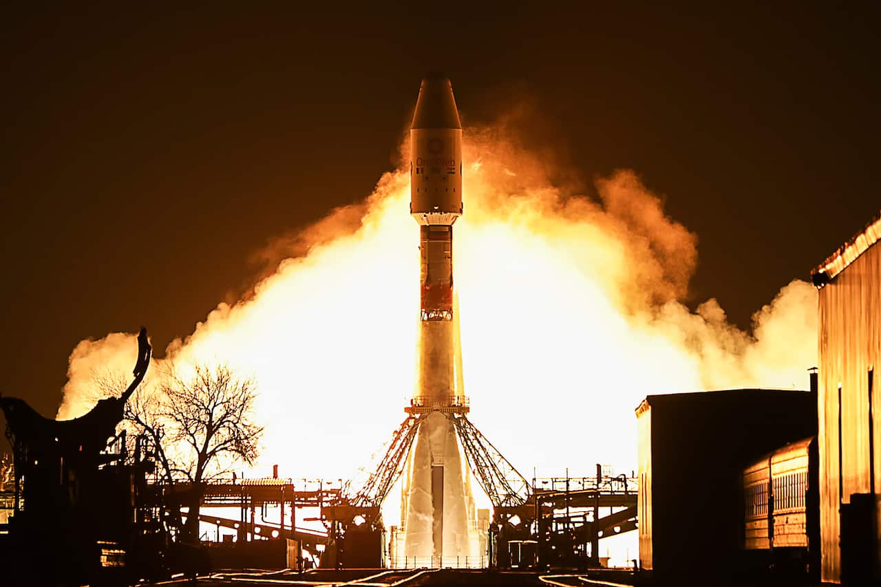 A Soyuz-2.1b rocket booster with a Fregat upper stage lifts off from the Baikonur Cosmodrome in the south of Kazakhstan.