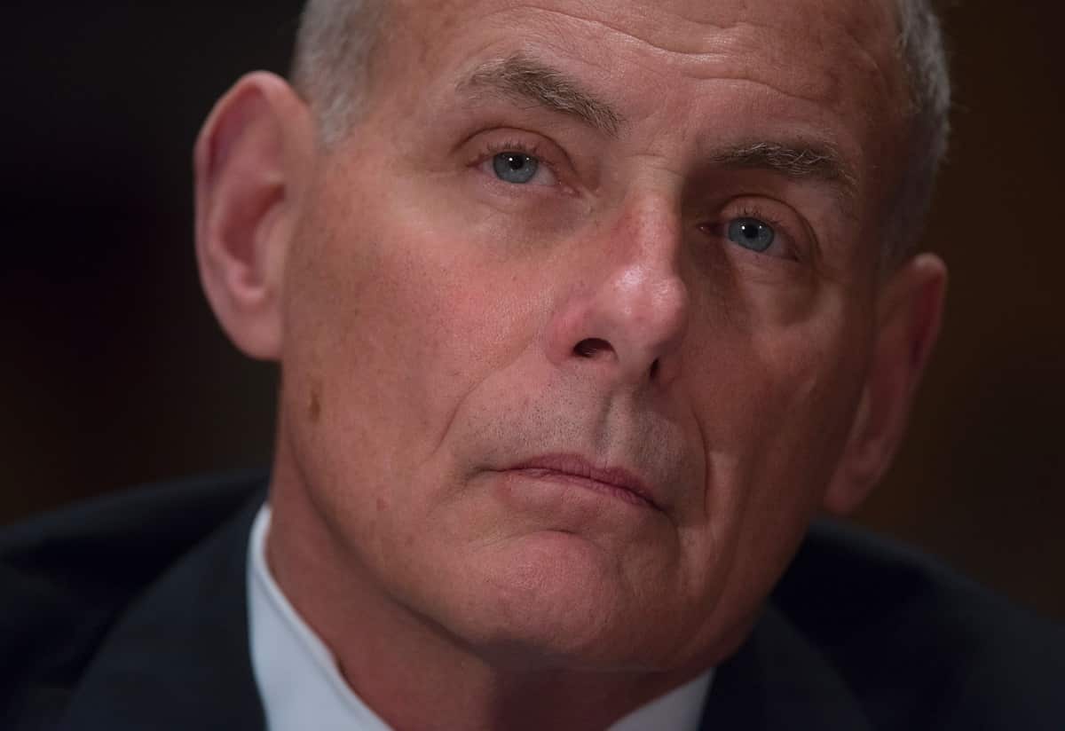General John Kelly listens to questioning while testifying at a Senate Homeland Security and Governmental Affairs Committee hearing.