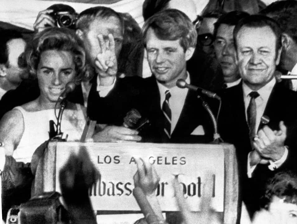June 5, 1968: Presidential hopeful Senator Robert F. Kennedy waves goodbye to his supporters as he prepares to leave the Ambassador Hotel ballroom.