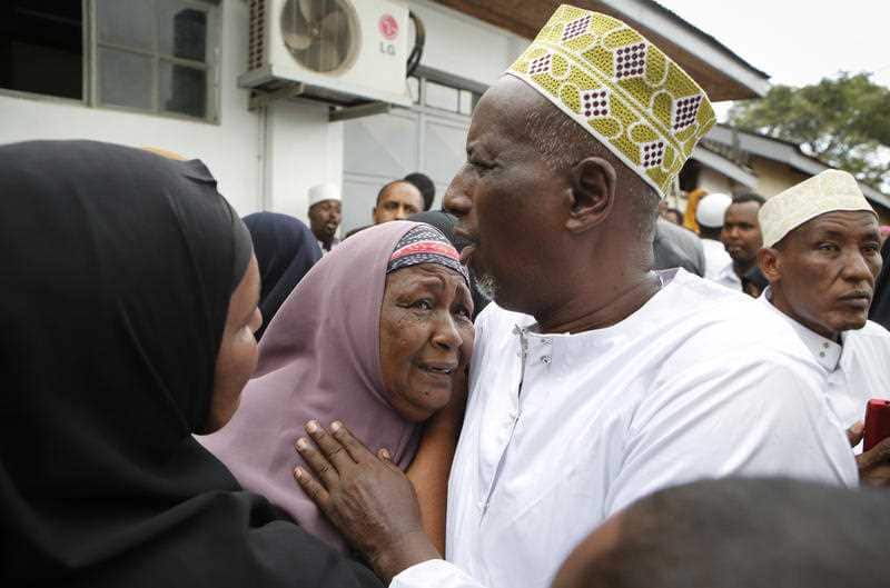 Mourners grieve as they prepare to pray over the bodies of Abdalla Dahir and Feisal Ahmed, who were both killed in Tuesday's attack.