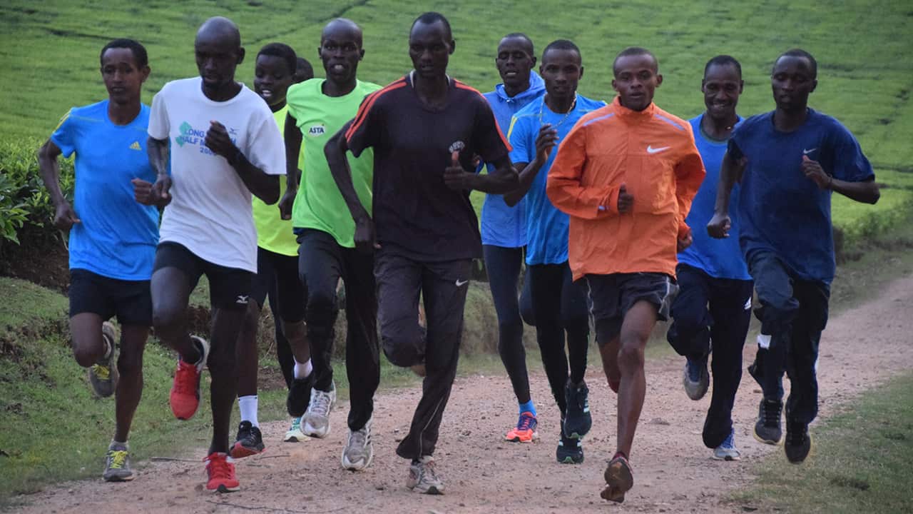 25-year-old Julius Kiprono Tarus leads his training group on an evening training run. Julius has never taken drugs and is frustrated by those who do. 