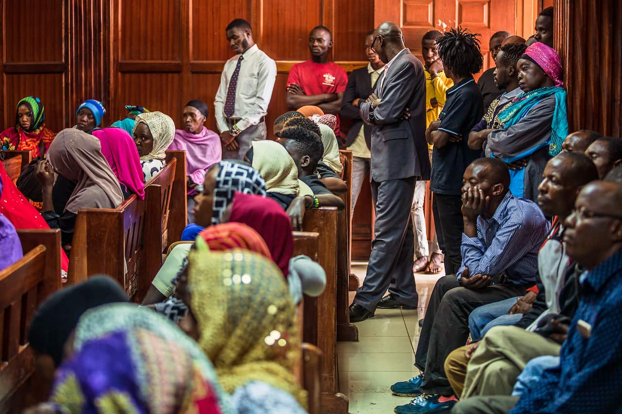 People gather inside a courtroom in Nairobi, Kenya for a hearing into a new biometric national identification system.